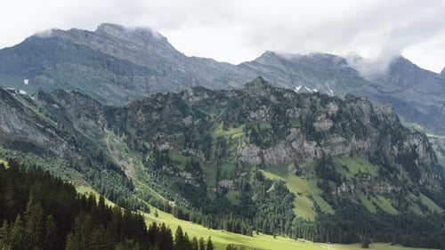 Epic Breathtaking Aerial Background Shot of Beautiful Famous Green Mountain Landscape View in Summer