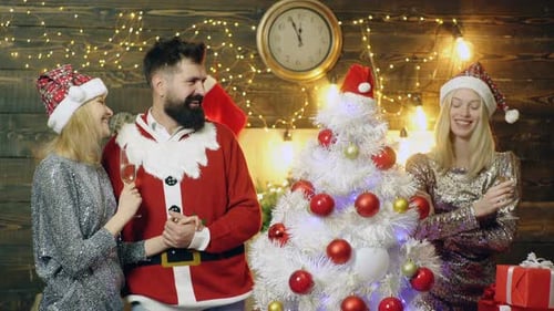 Friends Celebrate Christmas with Champagne and Gifts