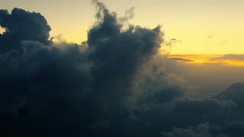 Aerial View of Clouds at Golden Sunset