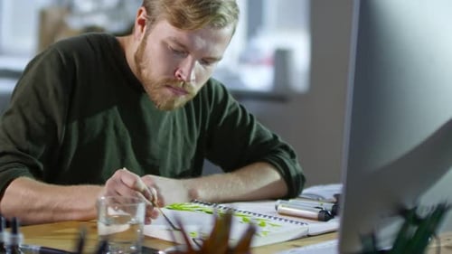 Illustrator Wetting Paper Before Painting