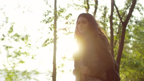 Portrait of Young Female Hiker in Green Forest