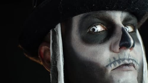 Frightening Man in Skeleton Halloween Cosplay Costume Looking Scary at Camera. Slow Motion