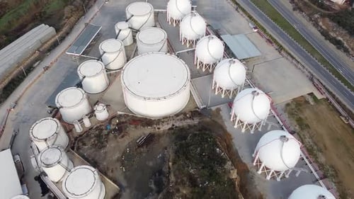 Aerial View of White Industrial Storage Tank Facility