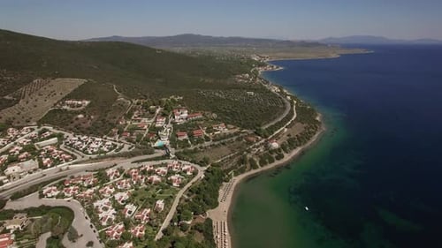 Aerial Scene of Sea, Coastline and Trikorfo Beach with Green Hills. Greece