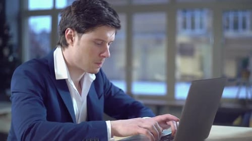 Guy Writing Mail on Laptop Indoors