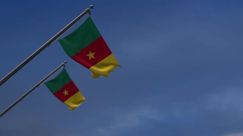 Cameroon National Flag Waving Against Blue Sky