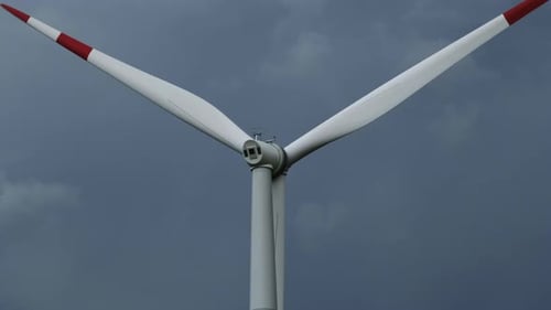 Windmill or Wind Turbine on Wind Farm in Rotation