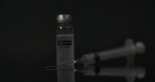 Vaccine and Syringe Still Life