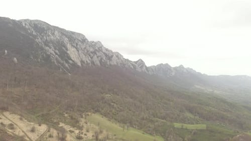 Mountain Veliki Krsh under heavy fog by early spring 4K drone video