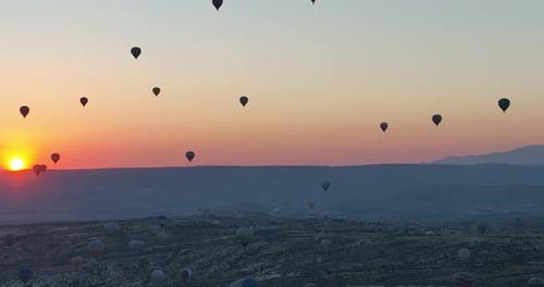 Aerial Cinematic Drone View of Colorful Hot Air Balloon Flying Over Cappadocia