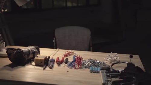 Weapons on Table in Dark Room at Night