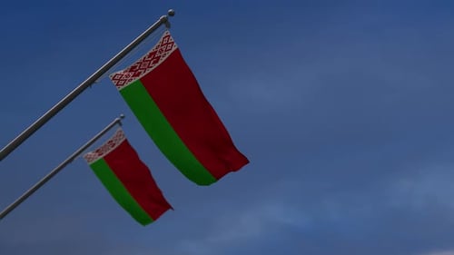 Realistic Belarus National Flag Waving in Blue Sky
