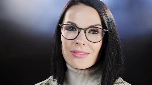 Middle Age Woman with Glasses Close Up Portrait on Dark Background, Casual Business Woman Looking
