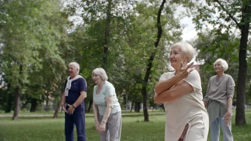 Seniors Exercising Together in a Park