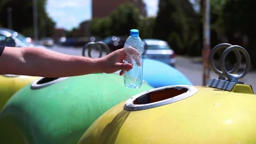 Plastic Bottle Recycled in Yellow Urban Bin