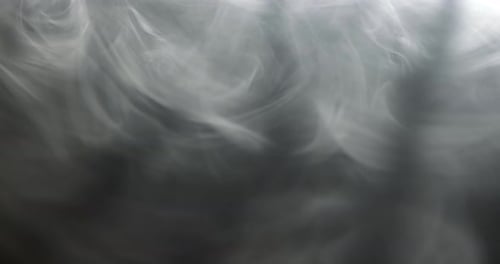 Abstract White Smoke Billowing on Dark Background