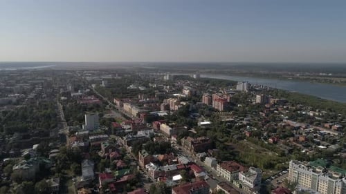 Aerial view of city with lots of trees and river 07