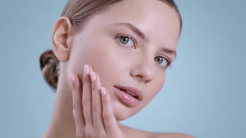 Young Woman Posing, Touching Her Face