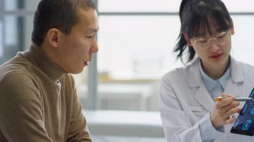 Friendly Doctor Explains Brain Scan to Patient