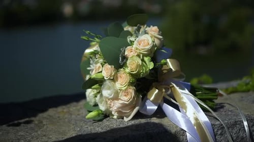 Elegant Wedding Bouquet with Roses and White Ribbons