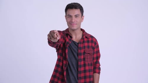 Happy Young Hispanic Hipster Man Pointing at Camera