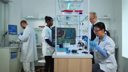 Scientists Conduct Experiments in Medical Lab