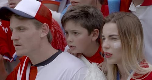 Intense Fans Watching Live Sporting Event