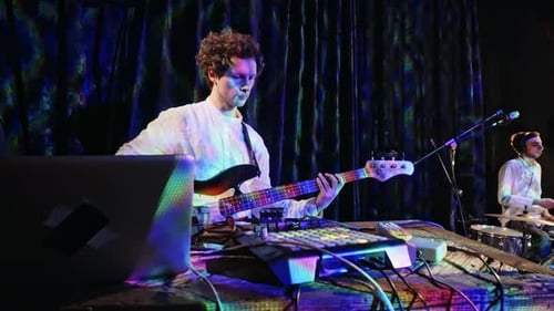 Musicians Perform with Bass Guitar and Drums