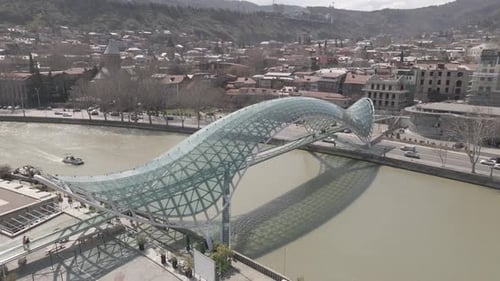 Tbilisi, Georgia - April 2 2021: Aerial view of Tbilisi city central park and Bridge of Peace.