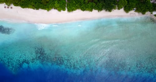 Daytime above copy space shot of a white sandy paradise beach and aqua turquoise water background in