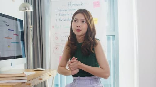 Teacher Explains Lesson From Home Classroom