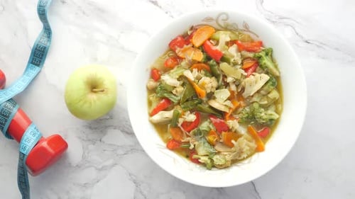 Healthy Meal with Apple and Exercise Equipment