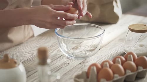 Cracking Fresh Egg into Bowl for Baking