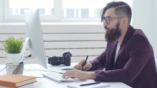 Man Working at Computer with Graphics Tablet