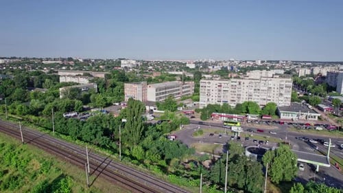 Aerial View of Empty Doubletrack Railway Line Leading Through Town