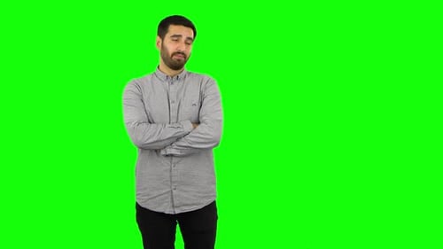 Brunette Guy Is Listening To Boring Information and Yawning. Green Screen