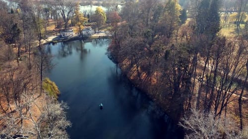 Arial Drone View Flight Over Lake in Park on Sunny Autumn Day