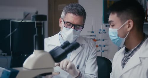 Professor and Student Discussing in Laboratory
