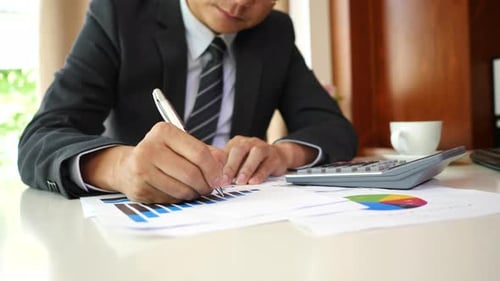 Businessman hands doing analysis planning business project in office.