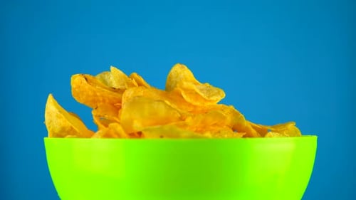 Potato Chips Poured into Green Bowl