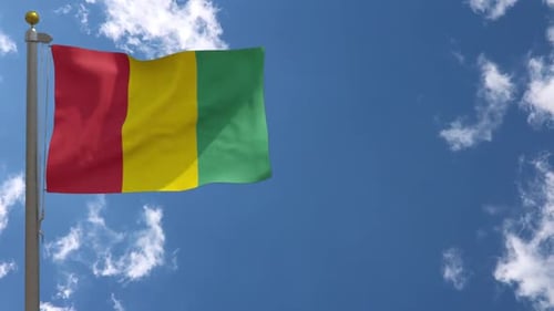 Guinea National Flag Waving in Blue Sky