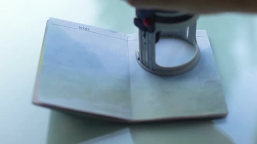 Passport being stamped for travel