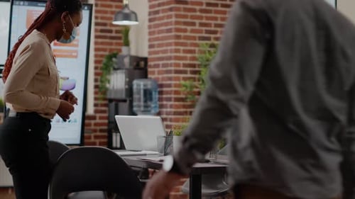 Team of Diverse Coworkers Arriving at Business Meeting in Office