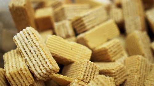 Many Golden Delicious Waffles Close Up Rotating Background for Biscuit Joy.