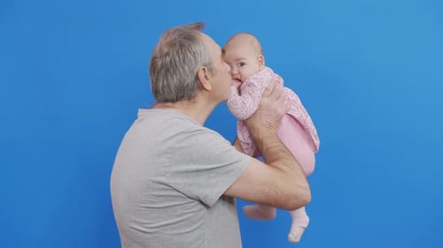 Funny Games and Laugh of Caucasian Old Man and Baby Kid in Domestic Comfort