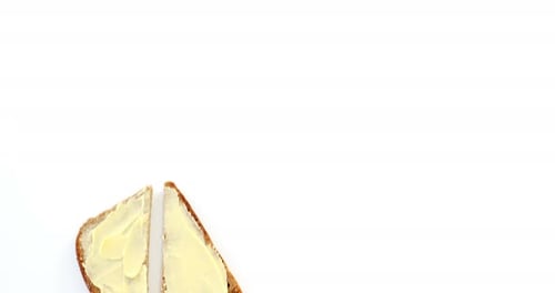 Buttered Toast Slices on a Clean White Surface