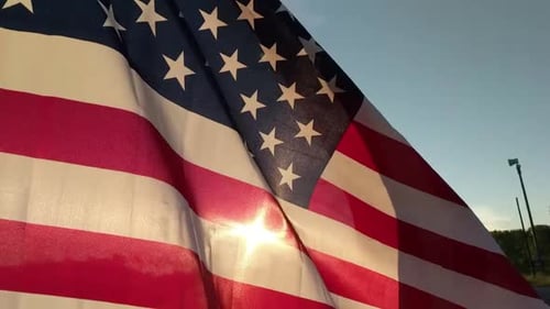 American Flag Waving in the Wind in Sunlight