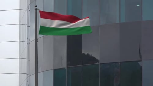 Waving Hungary Flag on Modern Corporate Building