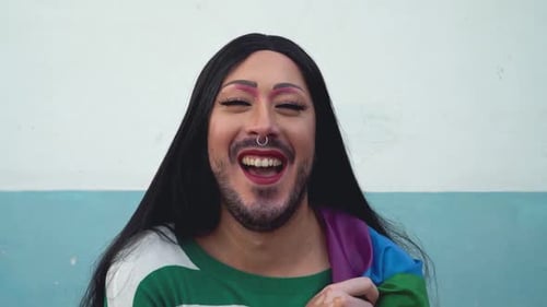 Happy drag queen activist having fun during gay pride parade - LGBT social movement concept