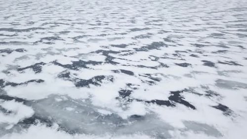 Aerial Drone View Flying High Above Frozen Ice Lake In Winter 2